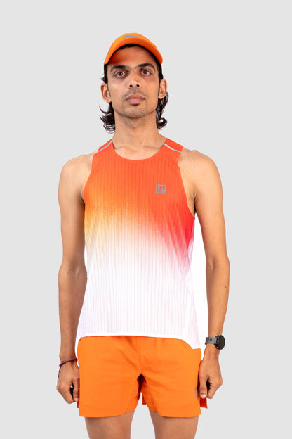 Person wearing an orange and white gradient tank top and shorts with a white background